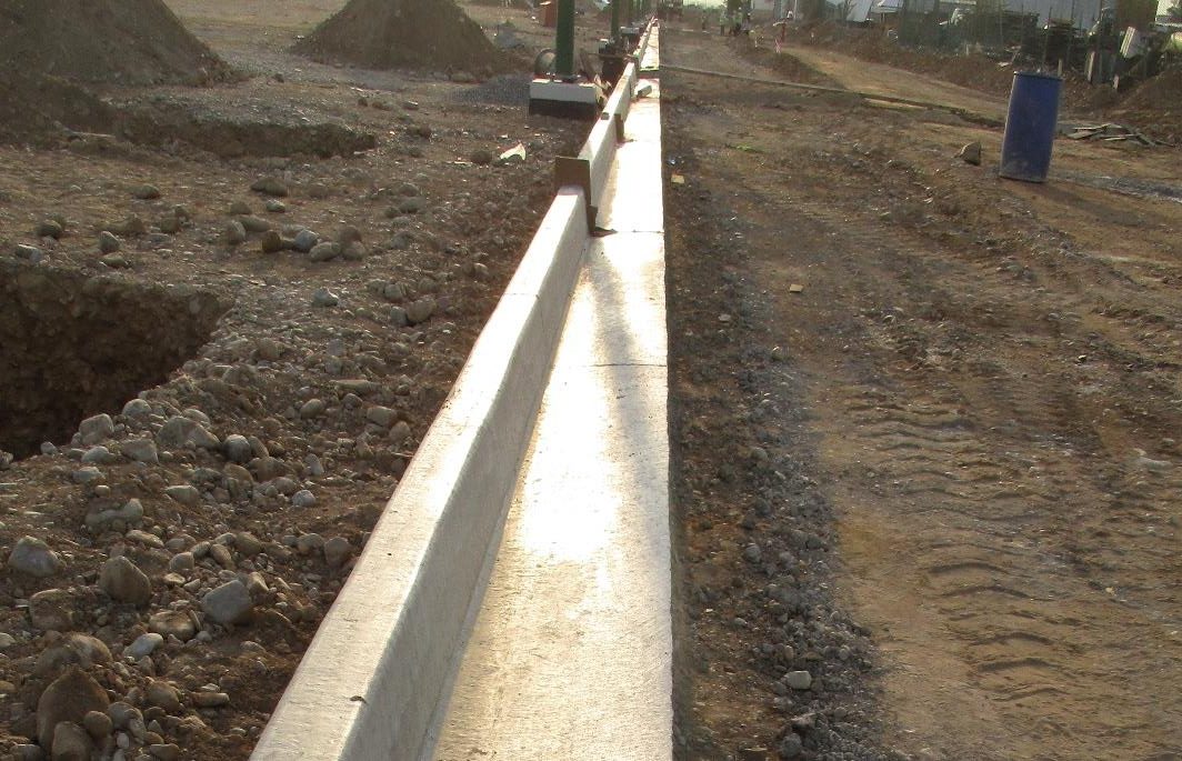 Concrete curb installation in progress