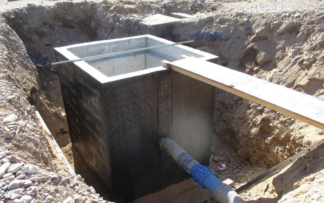Reinforced concrete utility chamber and pipe inlet